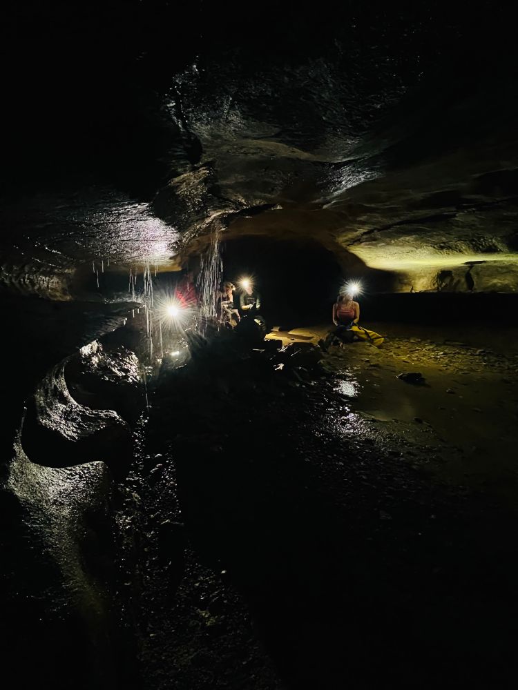 Hard to believe a 400' shaft is waiting just a few feet from this dripping manhole in the ceiling. We parked it here for a bit of rest and snacks. 