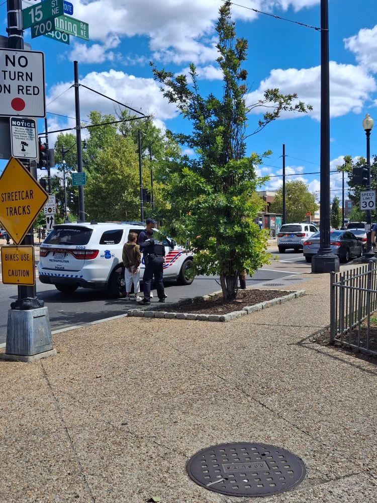 MPD vehicles detaining individuals on H and Benning