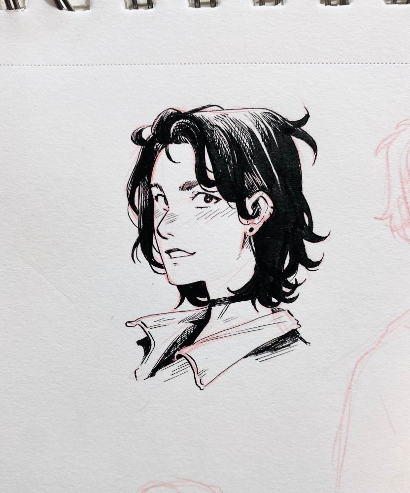 A small bust ink of a woman with black hair