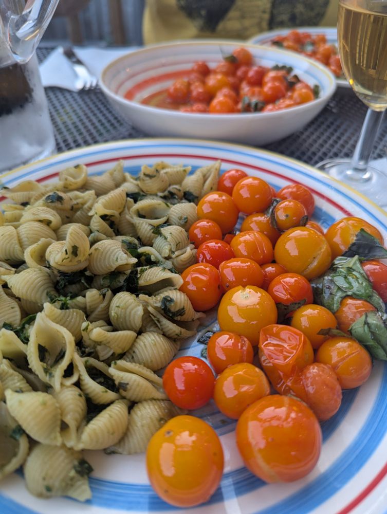 Pesto pasta with orange cherry tomatoes 