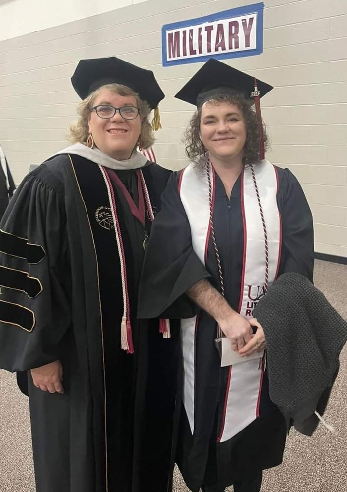 Graduate School professor and myself dressed up in caps and gowns.
