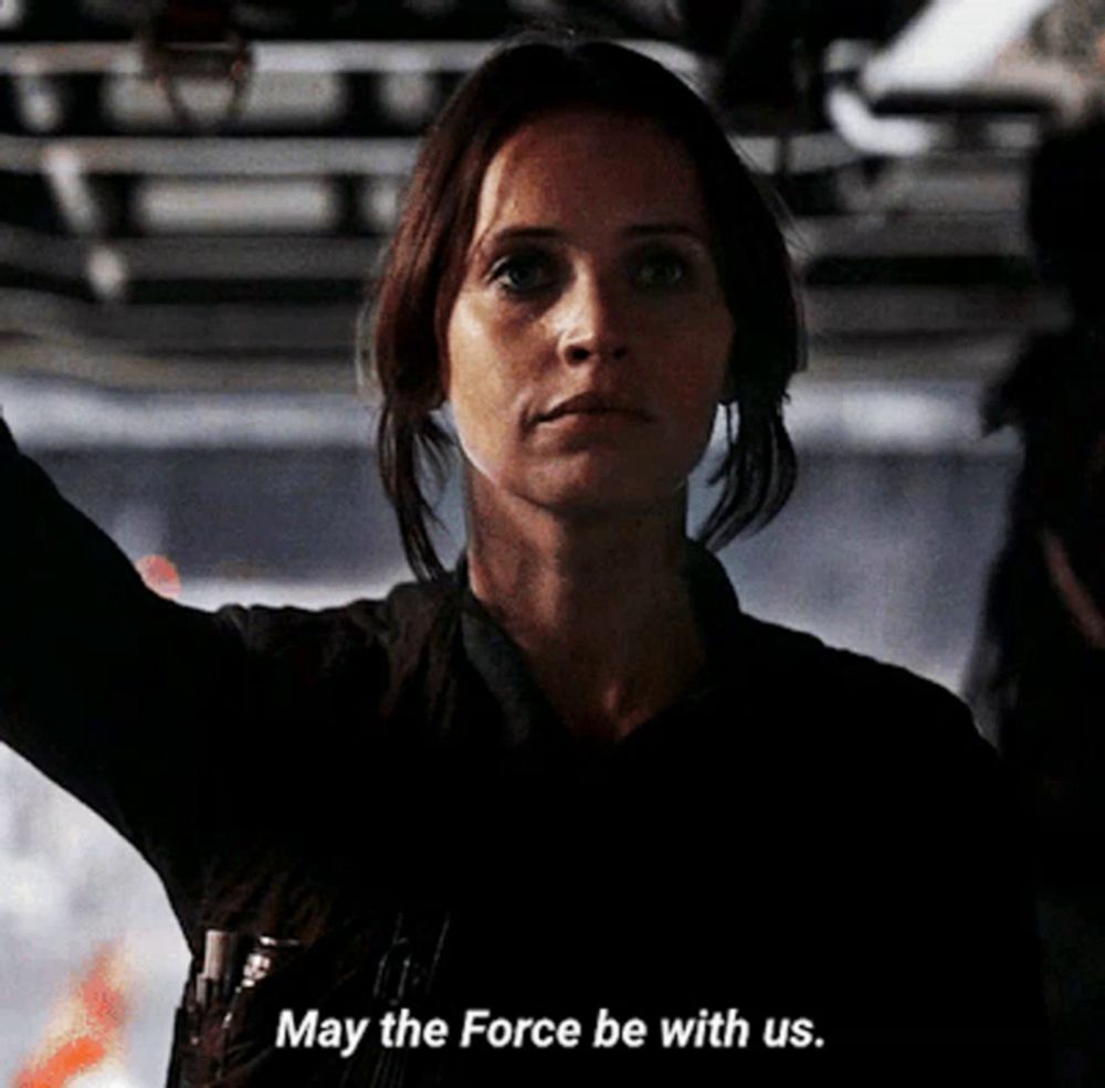 a woman says " may the force be with us "