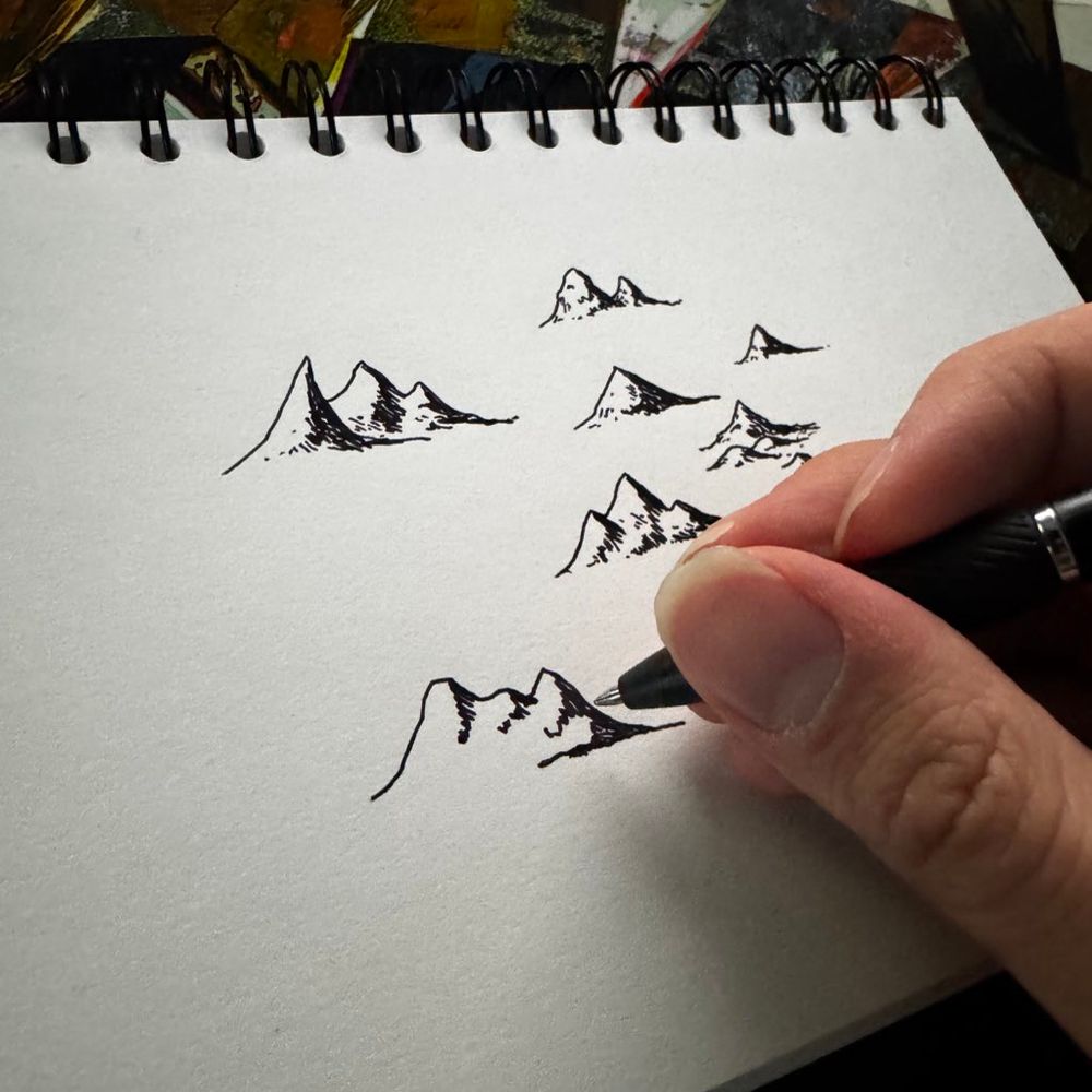 Mountains sketched on a notebook