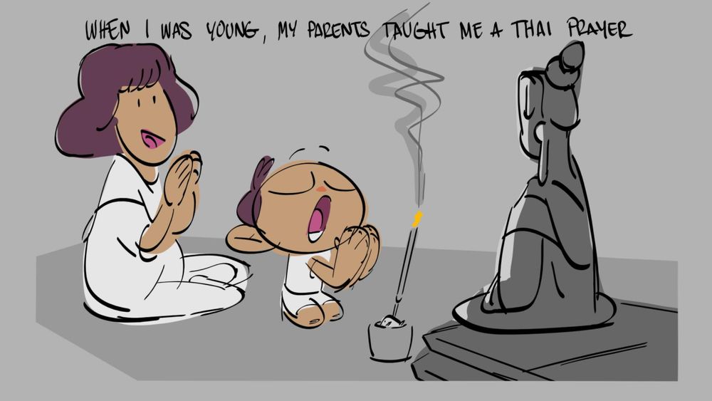 A boy praying to a statue of buddha with his mother seated behind him. 
Caption: When I was young, my parents taught me a Thai prayer. 