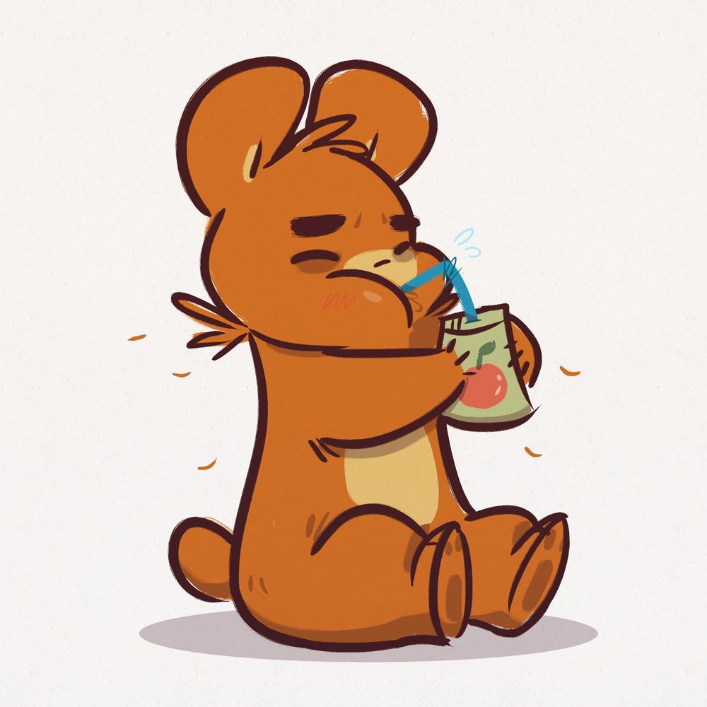 Bear happily sipping apple juice through a straw.