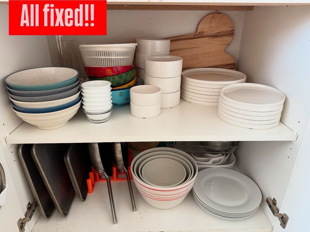 Kitchen shelf, showing various types of plates and bowls, stacked neatly