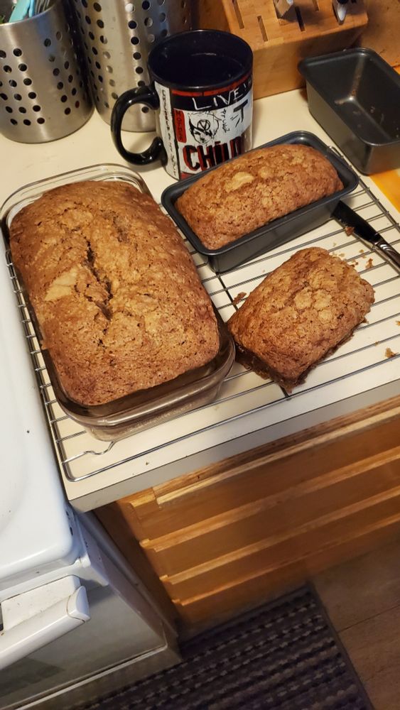 3 loaves of zucchini bread sitting on a kitchen counter
