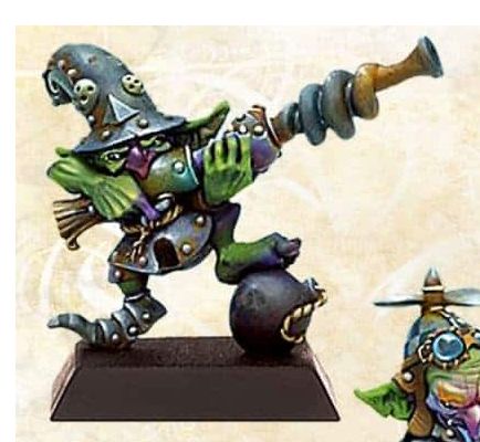 photo of a goblin wearing a pointed helmet and armour and holding a blunderbuss with a spiral barrel they have one foot on an old-fashioned bomb with a fuse