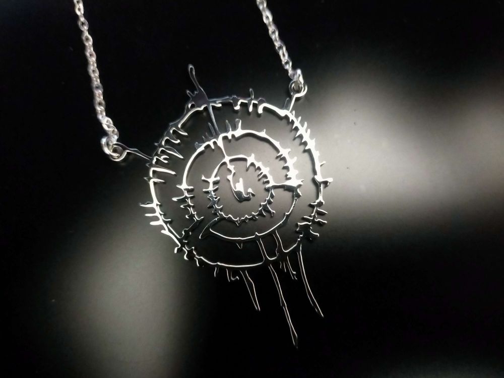 A Necklace portraying the Infernal Contract scored into the back of Astarion Ancunin from Baldur's Gate 3.