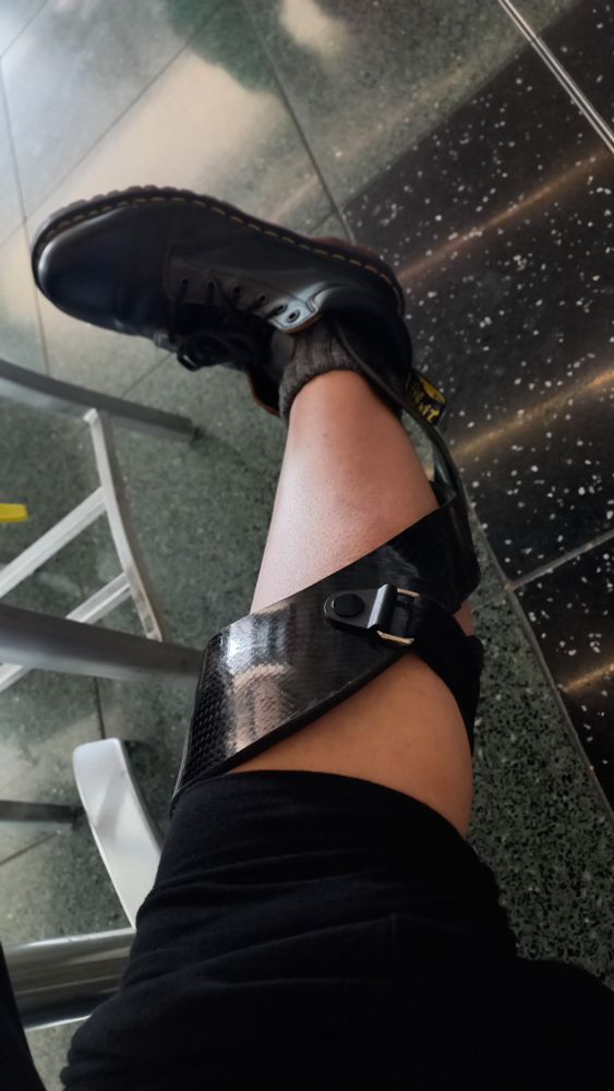 A leg in a black helix leg brace and boot.