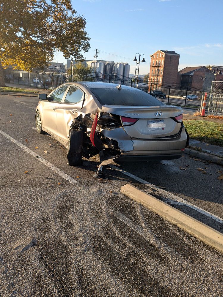 Smashed up car in the central parkway bike lane