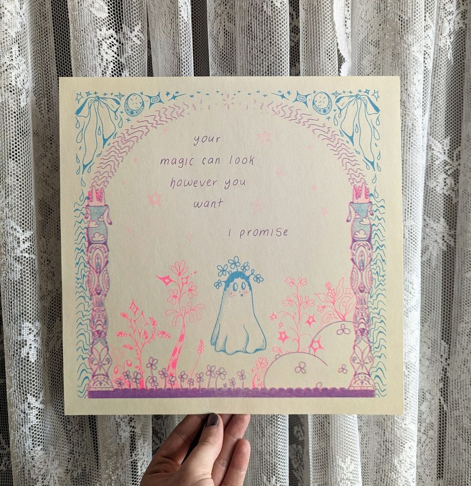 Riso print of a ghost in a magic portal in vibrant pink and blue, the ghost is growing flowers out of its head and tgere is text above it reading -your magic can look however you want, I promise-