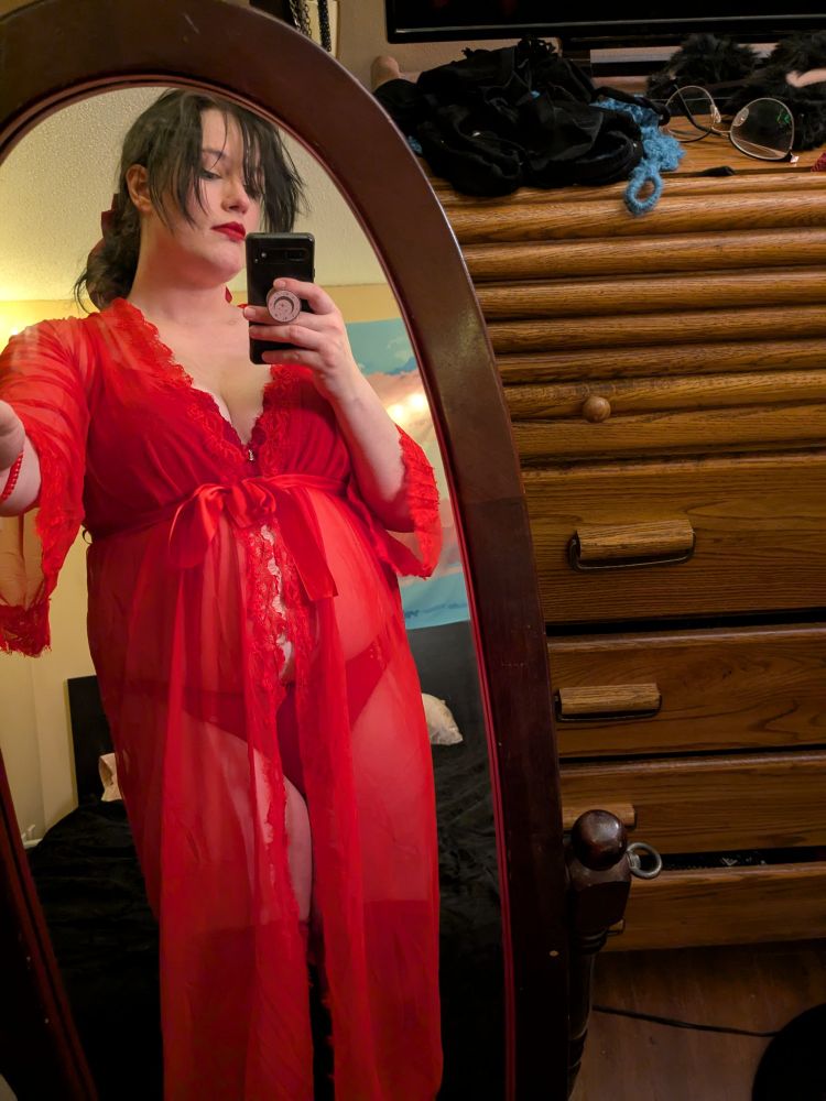 triz in a red sheer robe with red lingerie underneath 
