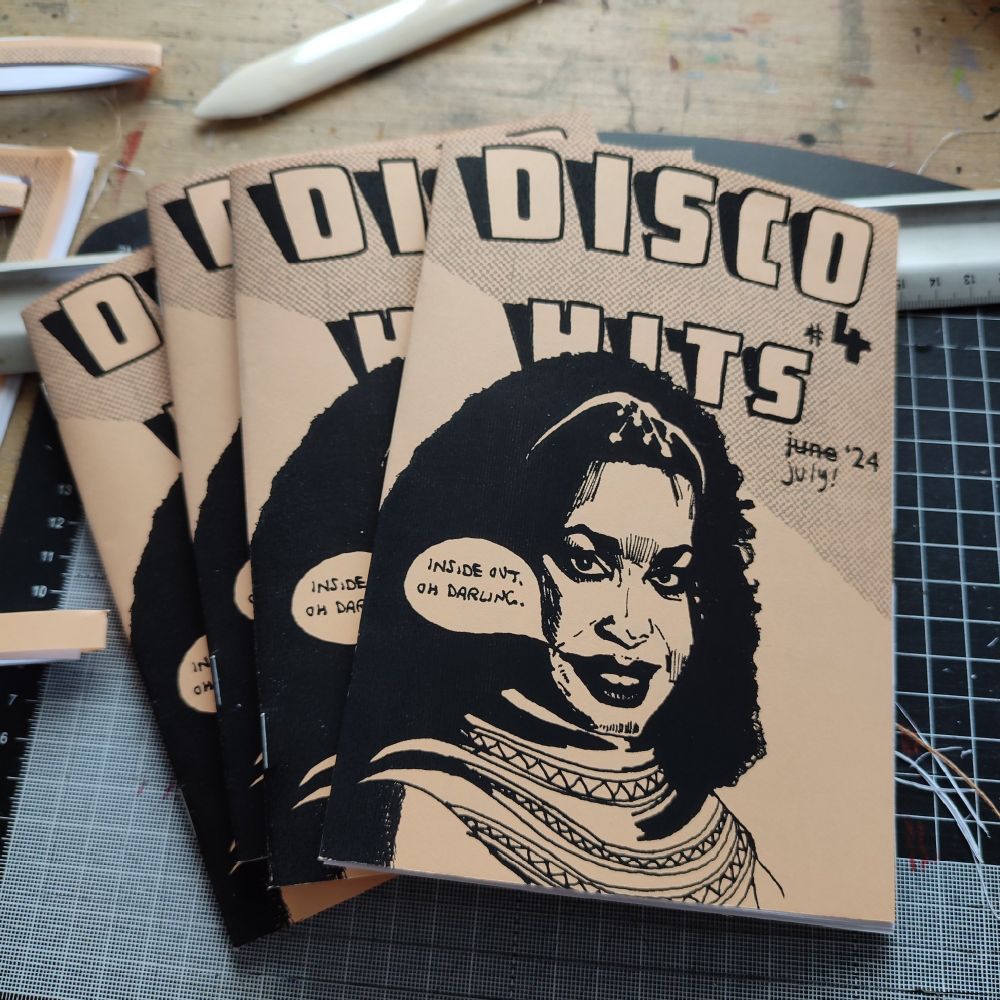 Four copies of Disco Hits zine. The front cover features Lillian Lopez of Odyssey.