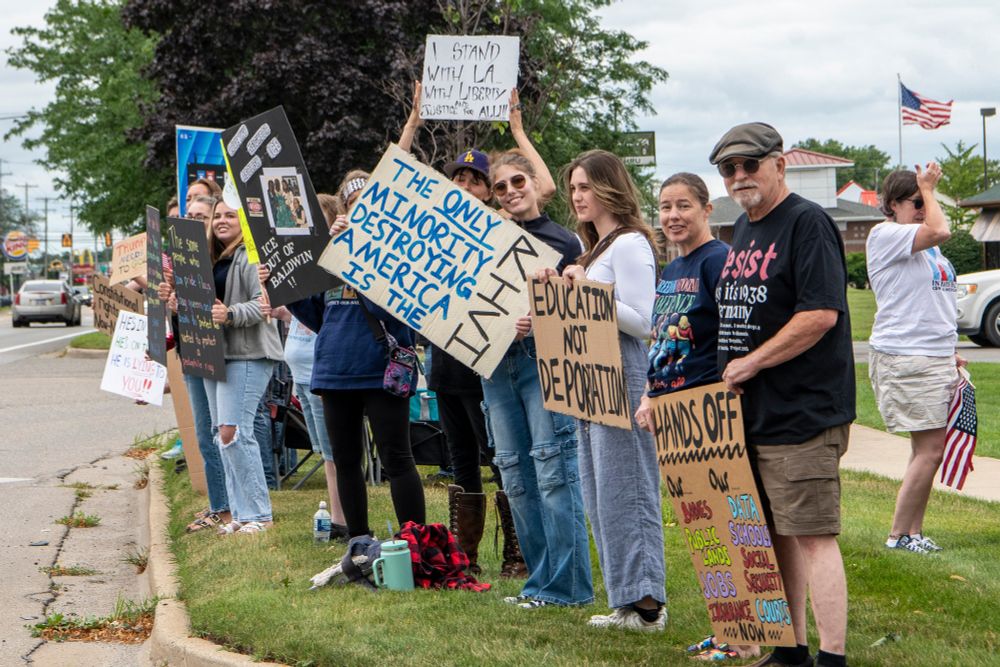 Community members gathered for the Indivisible Central Michigan "Good Trouble Lives On" action July 17 in Mt. Pleasant MI.