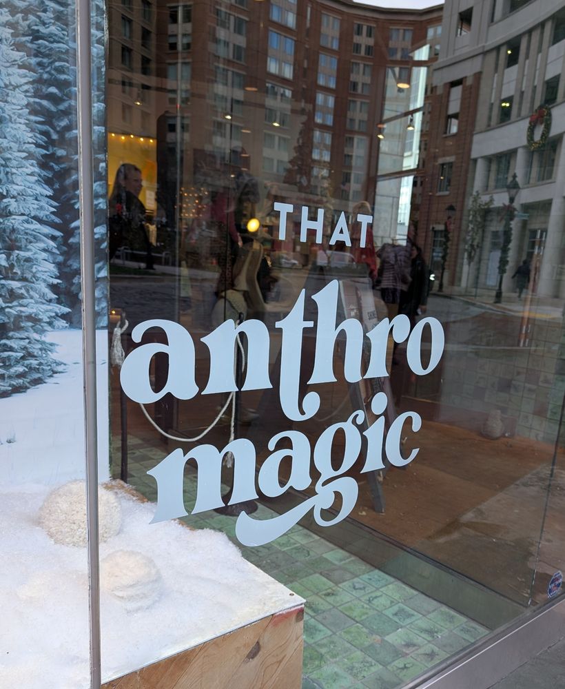Window in Baltimore with the words "that anthro magic"