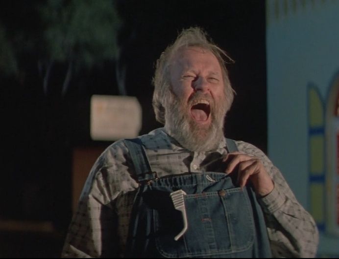 M. Emmet Walsh laughing and bearded in Sundown: The Vampire In Retreat