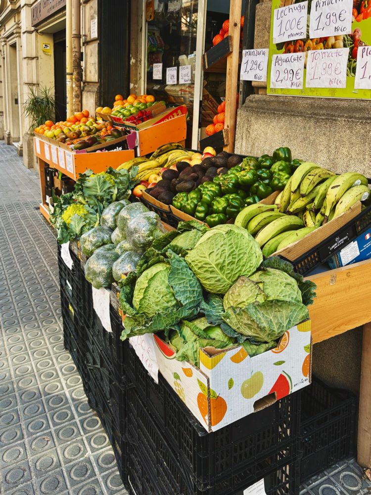 Photo of a fruit and vegetable stand on the street