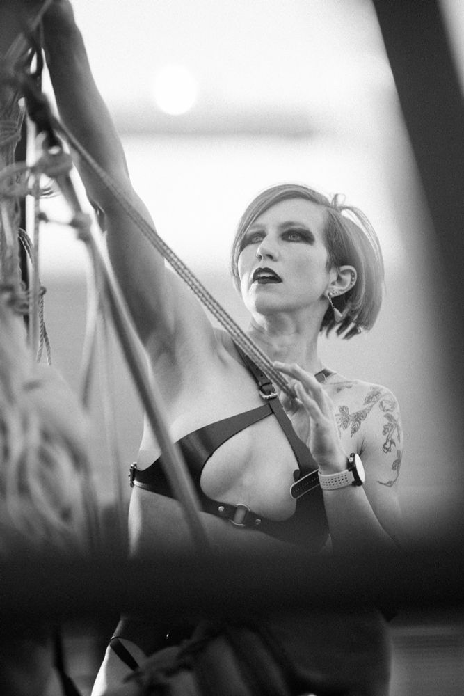 Black and white photo of two people doing rope