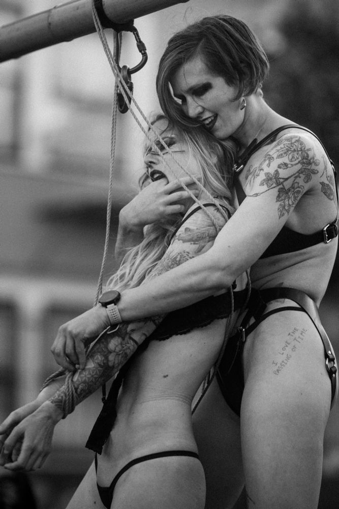 Black and white photo of two people doing rope