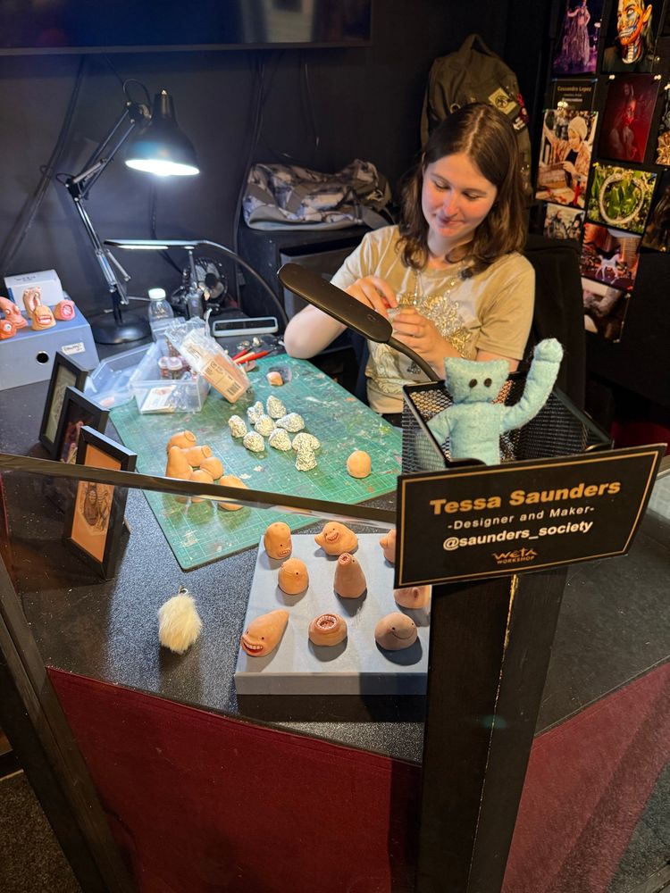 Tessa and a collection of Jameses, her weird little sculpted Guys, at Wētā Workshop