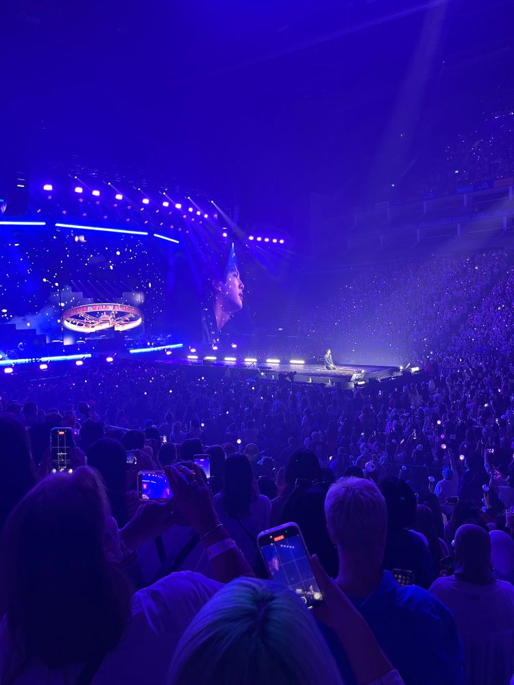 Jin in a purple ocean during Spring Day. Concert at O2 London 5 August 2025.