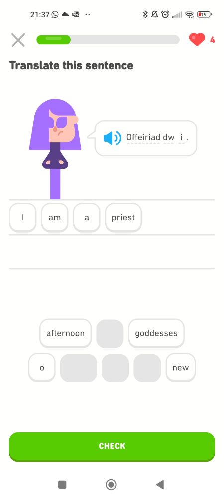 Another Duolingo screenshot. This time a purple haired sulky looking cartoon girl says 'Offeiriad DW i', translated below as 'i am a priest '.