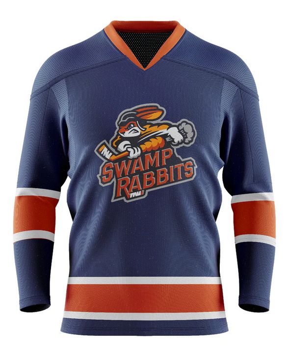 Hockey jersey of the Greenville Swamp Rabbits. Features a navy blue hockey jersey with large orange stripes sandwiched between two smaller white stripes. The mascot is a rabbit holding a hockey stick that looks like a carrot.
