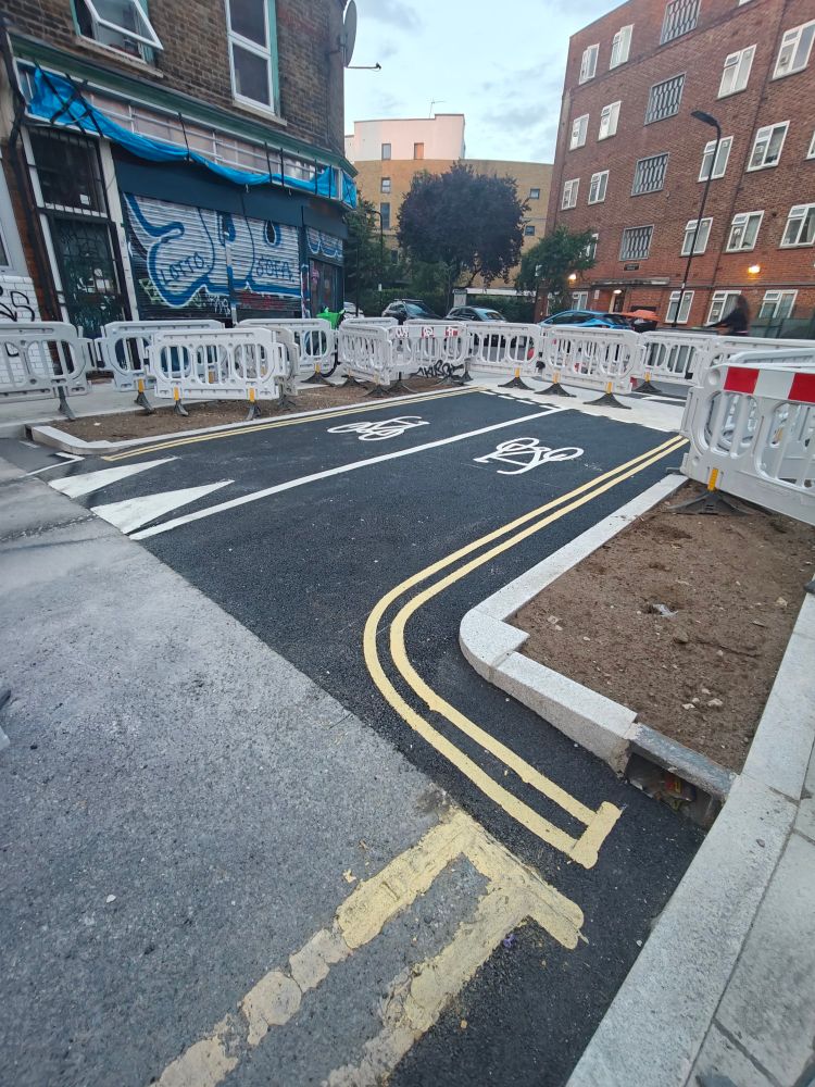 Road works on Dove Row with cycle signage and continuous pavement 