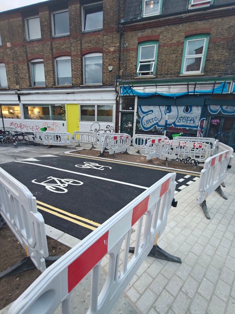 Road works on Dove Row with cycle signage and continuous pavement 