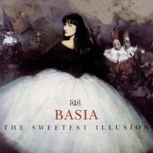 The album cover of Basia's The Sweetest Illusion. Her back is to the viewer, but her head is turned around facing us. She is wearing a black, long-sleeved top with bare shoulders and a large white skirt. In front of her are three characters with conical hats and white peter pan collars.