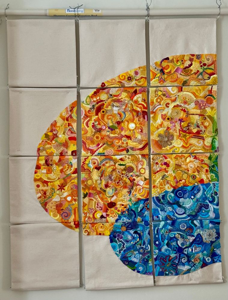 12 10x10 squares hanging (3 across and 4 down) It is the beginning of a huge hand embroidered brain. The frontal lobe is in hues of yellow and orange and mostly complete. The temporal lobe is about half done and in shades of blue. Stitching is all abstract, improvisational with many different stitches and also includes buttons, beads, tatting, trim, felt and mirrors 