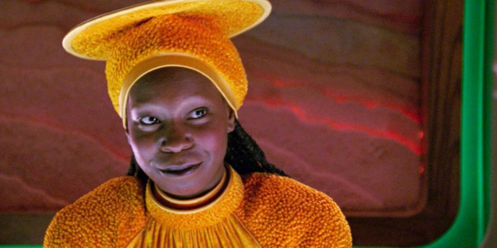 Guinean from Star Trek TNG, wearing an orange outfit