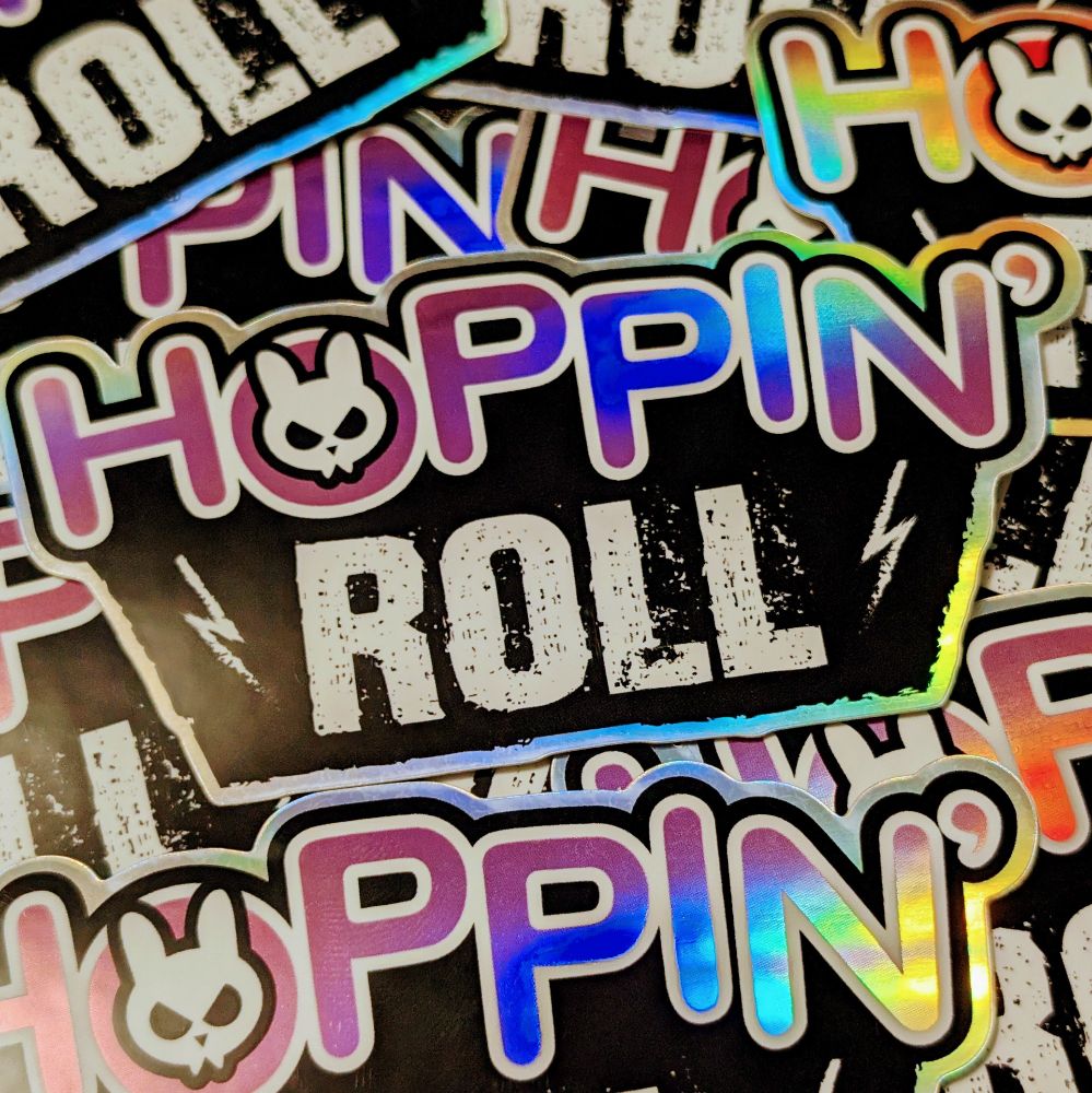 A holographic sticker pile of the Hoppin' Roll logo all over the place