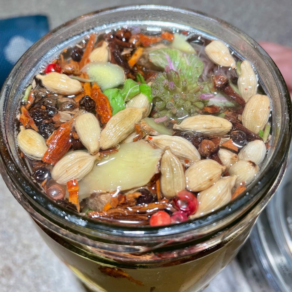 Beautiful, colorful herbal chai tea to warm people up in the cold weather. Ingredients: bee balm, cardamom, black & pink pepper, cinnamon, cloves, fresh ginger