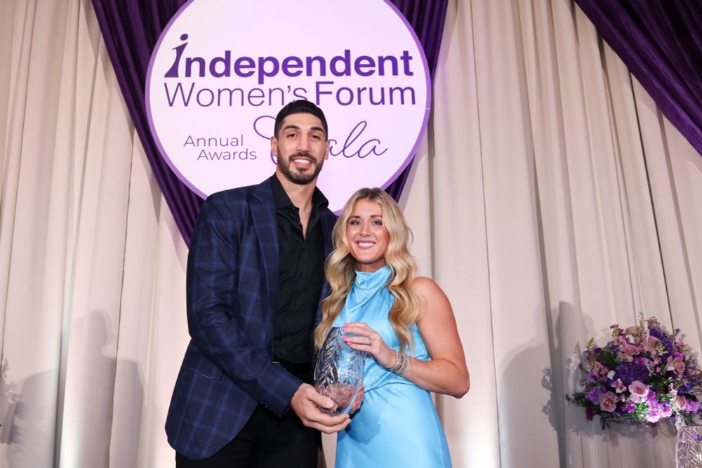 Enes Freedom  and Riley Gaines at a ceremony.