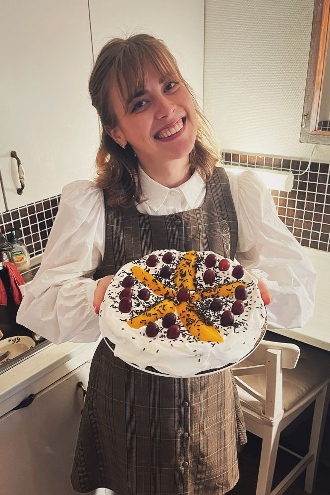 Me smiling with a cake in my hands