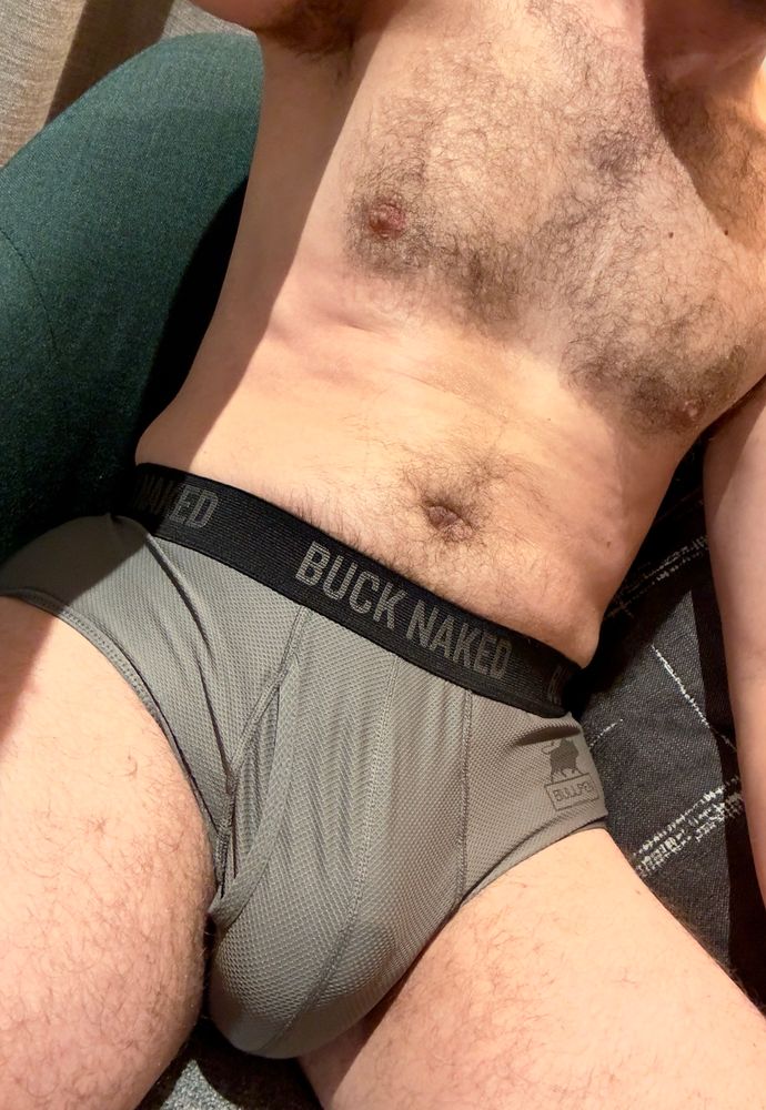 Shirtless selfie of man in grey briefs. 