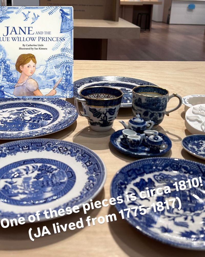 Photo shows the cover for Jane and the Blue Willow Princess amongst a display of blue willow pottery.