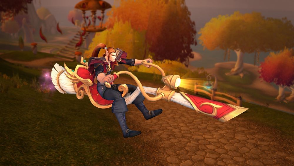 A World of Warcraft screenshot. A male Blood Elf is riding a... broom-stick / motorcycle mashup thing??? It's a broomstick with a luxury seat on it, with motorcycle-style handlebars and headlight.