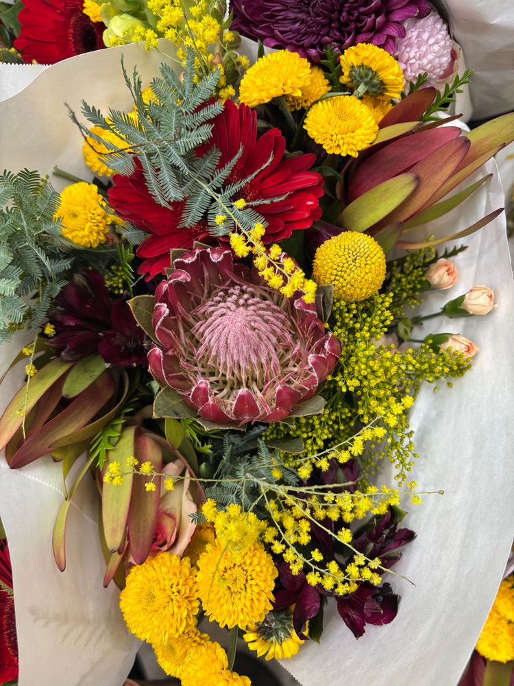 A bouquet of yellow and red flowers. 