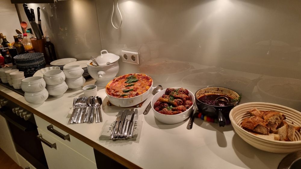 The prepared food, waiting for our guests: vegan pimpkin-ginger-coconut soup, gnocchi alla sorrentina, chicken drumsticks in sesame-soy-honey glazing, chorrizo in red wine, and bread