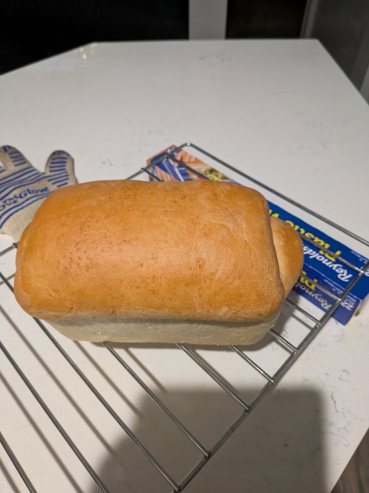 The same loaf, now out of the pan sitting directly on the rack