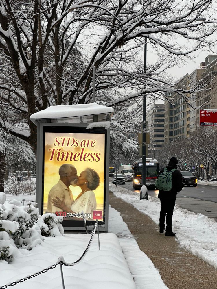 Ad showing kissing couple and the tagline STDs are Timeless