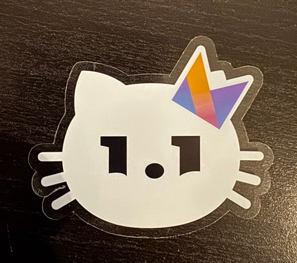 Cute kitty sticker celebrating Kotlin 1.1 release.