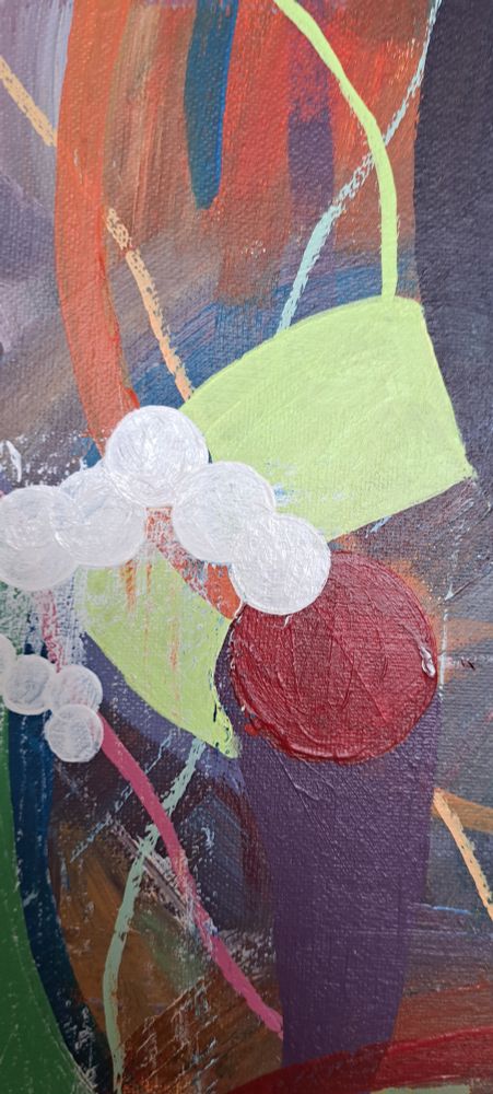 Detail of art in progress - swipe of pal yellow/green with candy pink line, red blob and purple swipe with smaller orange swipes and white dots