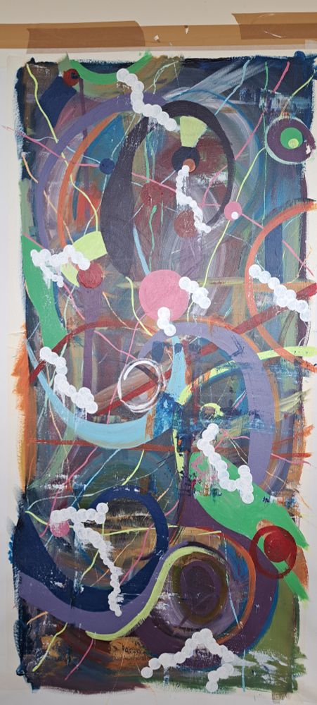 Photo of art in progress - added bolder colours including purple green & blie. Also added large white dots. Still swirly
