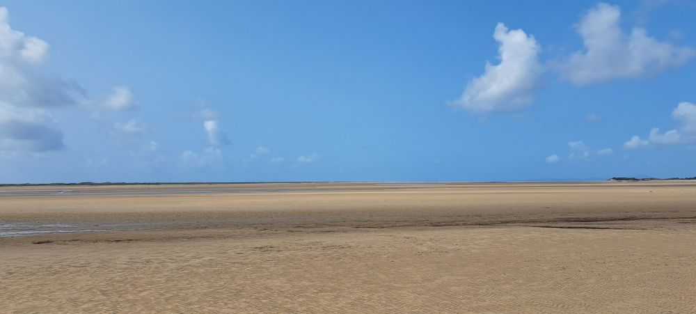 Photo of the beach at portmeirion showing sand on the lower half and sky the top half. No sign of the sea at all!!