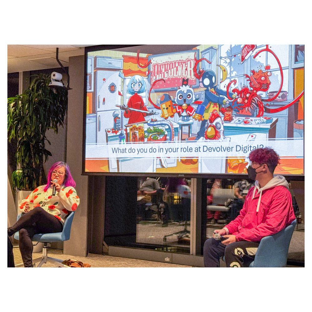 a photo of Clara Sia answering questions at the bus game dev q & a
