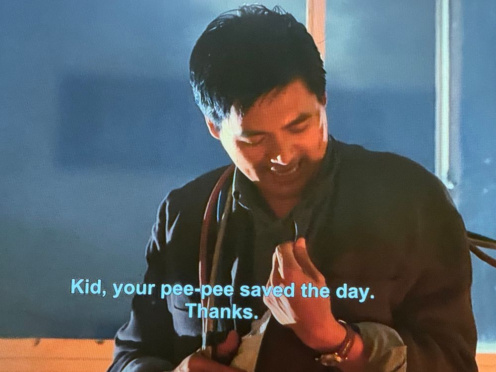 a screencap of Hardboiled with a subtitle that says “Kid, your pee-pee saved the day. Thanks.”